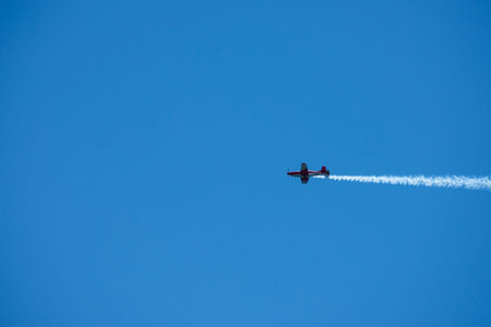 TORRE DEL MAR, SPAIN - JULY 29, 2018 planes flying over the beach in a seaside town, aerobatics...