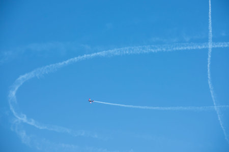 TORRE DEL MAR, SPAIN - JULY 29, 2018 planes flying over the beach in a seaside town, aerobatics...