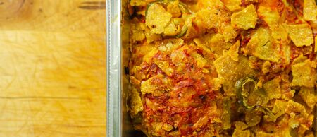 Chicken breast fillets with a chilli and cheese tomato sauce, Cheddar and chilli crushed nacho crumb and grated cheese, mexican foodの写真素材