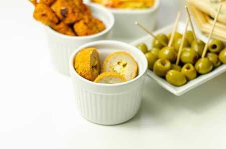 Savory mini scotch eggs in white ceramic bowl, traditional English snack, appetizerの写真素材
