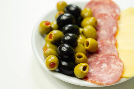 Set green and black olives with salami and cheddar cheese, starterの写真素材