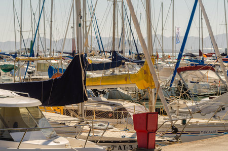 LOS ALCAZARES, SPAIN - FEBRUARY 25, 2019  A beautiful marina with yachts and motor boats in the...