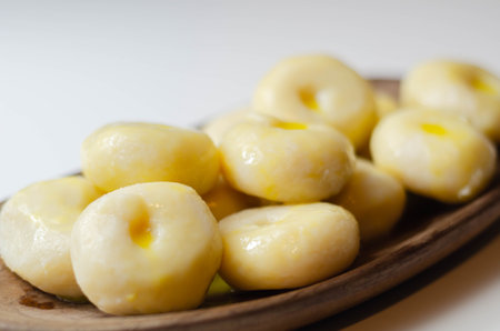 Traditional Silesian dumplings with a hole,  homemade noodles served with butter, Polish cuisine