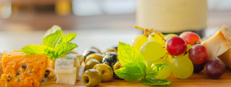 British hand-made and selected cheeses from local farms served on a wooden board, a unique setの写真素材