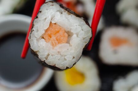 Close up of  smoked salmon hosomaki roll, traditional Japanese food, sushiの写真素材