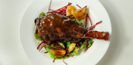 Delicious Lamb shank with red wine and rosemary gravy served on the mixed leaf salad, exclusive dish