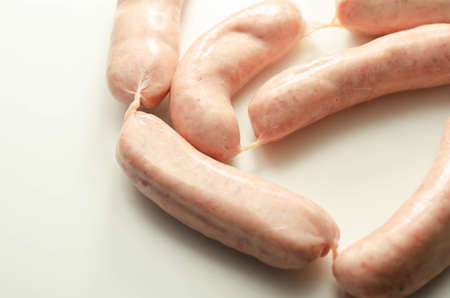 Raw classic British sausage made from prime cuts of pork on the white background, prime pork sausagesの写真素材