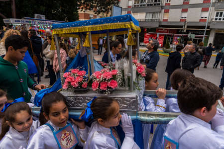 VELEZ-MALAGA, SPAIN, MARCH 24, 2018 Children participating in the procession associated with the holy week in a Spanish townのeditorial素材
