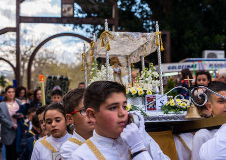 VELEZ-MALAGA, SPAIN, MARCH 24, 2018 Children participating in the procession associated with the holy week in a Spanish townのeditorial素材