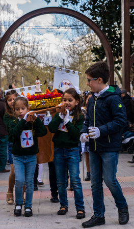 VELEZ-MALAGA, SPAIN, MARCH 24, 2018 Children participating in the procession associated with the...
