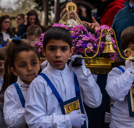 VELEZ-MALAGA, SPAIN, MARCH 24, 2018 Children participating in the procession associated with the...
