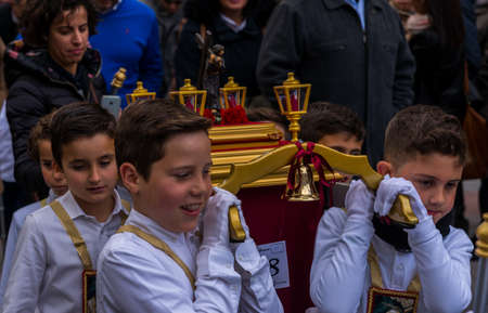 VELEZ-MALAGA, SPAIN, MARCH 24, 2018 Children participating in the procession associated with the holy week in a Spanish townのeditorial素材