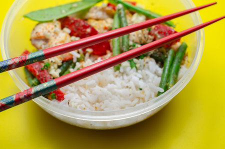 Cooked chicken breast pieces in a red Thai curry sauce made with coconut cream, red chillies,...