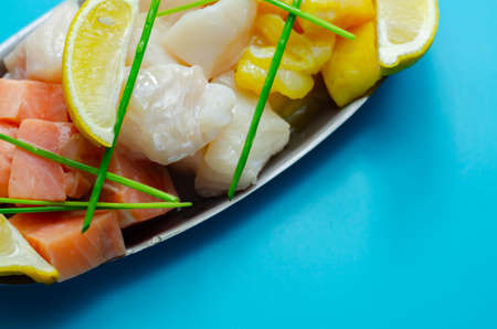 Fish pie mix, defrosted, skinless and boneless cod, dyed smoked haddock and salmon, sea foodの写真素材