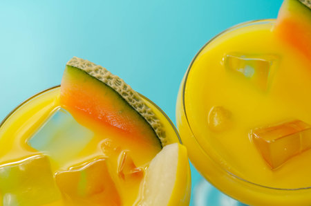 A holiday cocktail based on vodka, liqueur and fresh melon, a refreshing drink prepared by a bartender, sumertimeの写真素材