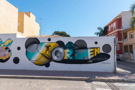 LOS ALCAZARES, SPAIN - FEBRUARY 25, 2019 Walls sprayed by street artists in a Spanish small town, street artのeditorial素材