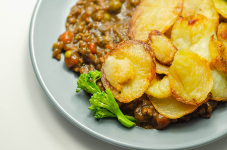 Minced beef hotpot, tender british beef in a warming gravy with carrots and peas, all topped with...