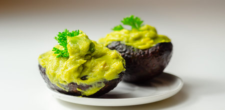 Smashed avocado,  smother avocado with lemon juice served on the for brunch, organic food