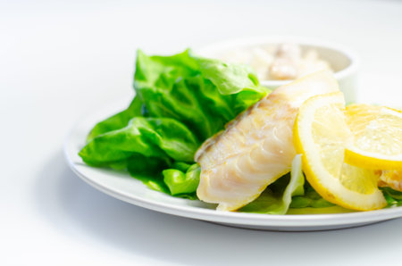 Steamed haddock fillet served with an exquisite salad consisting of cabbage, celery and apple with...