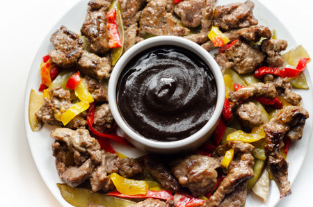 Beef strips with mixed peppers and mangetout served with black bean sauce, Chinese mealの写真素材