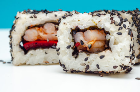 Closeup of sweet chilli pawn and red pepper California roll, traditional Japanese foodの写真素材