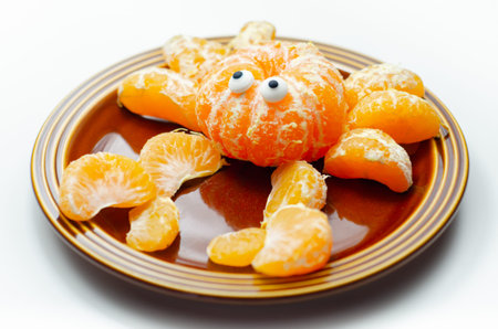 Fruit crab, a snack made of fresh parts of tangerines served in the shape of crab, funny foodの写真素材