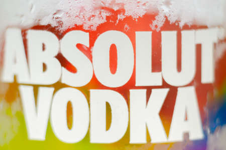 LONDON, UNITED KINGDOM - AUGUST 20, 2021 Bottle of Absolut vodka blue with a limited label with the rainbow flag, produced in Sweden, LGBT prideのeditorial素材