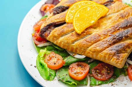 Tasty steak slice, british steak with sauce, potato and leek, wrapped in puff pastry, traditional...