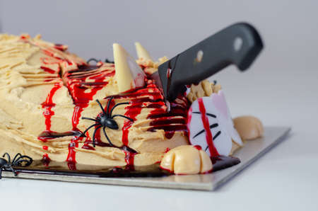 Halloween cake cat, layered biscuit cake in the shape of a kitty decorated for Halloween party, scary sweet dessertの写真素材