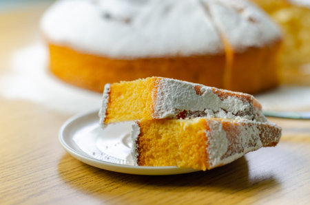 Portion of Madeira ring loaf cake served on a small plate, traditional cake