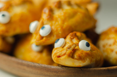 Mini pasties with decorating eyes, succulent pork, turkey, bacon and cranberry all wrapped in...