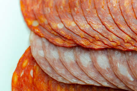 Set of three sliced Spanish sausages, two kind of chorizo and salchichon, cured and dried pork salami sausages, delicious meatの写真素材