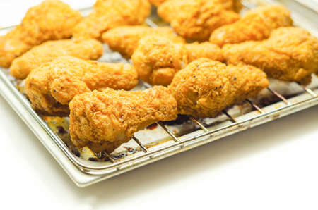 Southern crispy battered fried chicken wings, deep-fried chicken wings on the metal tray, fast foodの写真素材
