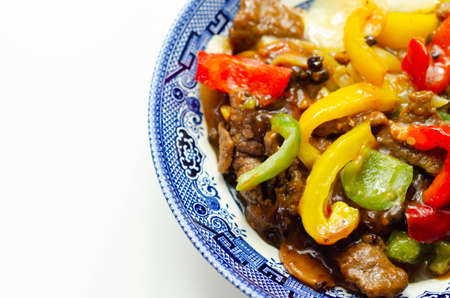 Cooked marinated beef slices with a savory black beef sauce, peppers and onions, Chinese foodの写真素材