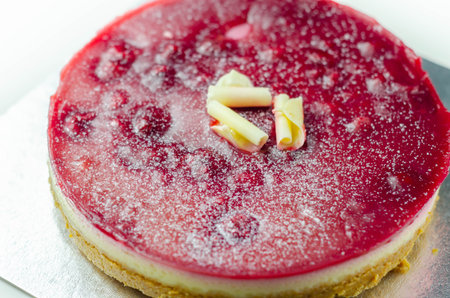 Digestive biscuits base with white chocolate cheesecake, Heritage raspberries and raspberry glaze...