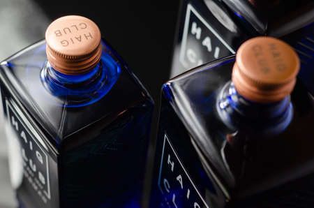 LONDON, UNITED KINGDOM - JANUARY 18, 2022  Smooth, sweet and enjoyable whisky Single Grain Scotch Whiskey in a designer square blue bottle, famous Haig Club Clubmanのeditorial素材