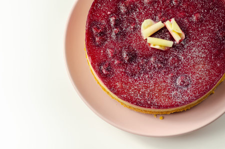 Digestive biscuits base with white chocolate cheesecake, Heritage raspberries and raspberry glaze...