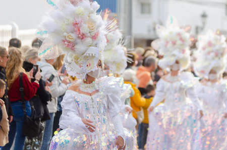 NERJA, SPAIN - FEBRUARY 26, 2022 Colorful carnival parade organized by the inhabitants of a famous town in the Malaga regionのeditorial素材
