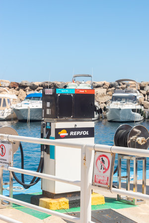 SAN JOSE, SPAIN - 23 MAY 2023 Point of fuel Repsol  supply to ships stationed in the bay in the town of San Jose, in the centre of Parque Natural de Cabo de Gata, Almeria provinceのeditorial素材