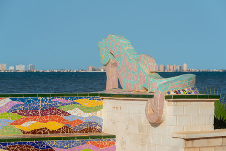 LOS NIETOS, SPAIN -  19 SEPTEMBER 2022 Seahorse sculptures on the shore of the Mar Menor lagoon, with the resort of La Manga on the horizon, Murcia, Spainのeditorial素材
