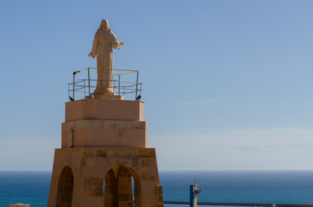 ALMERIA, SPAIN - 23 FEBRUARY 2024 White marble statue of the Sacred Heart of Jesus on one of the best panoramic views of the city of Almeria in Spainのeditorial素材