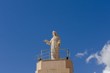 ALMERIA, SPAIN - 23 FEBRUARY 2024 White marble statue of the Sacred Heart of Jesus on one of the best panoramic views of the city of Almeria in Spainのeditorial素材