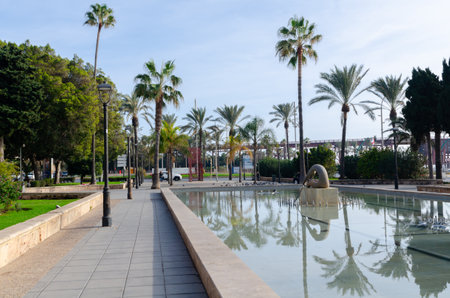 ALMERIA, SPAIN - 11 DECEMBER 2023 A fountain depicting a sculpture of a rowing man in a public park in the city of Almeria, in the province of Almeria, Andalusia, Spainのeditorial素材