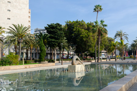 ALMERIA, SPAIN - 11 DECEMBER 2023 A fountain depicting a sculpture of a rowing man in a public park in the city of Almeria, in the province of Almeria, Andalusia, Spainのeditorial素材