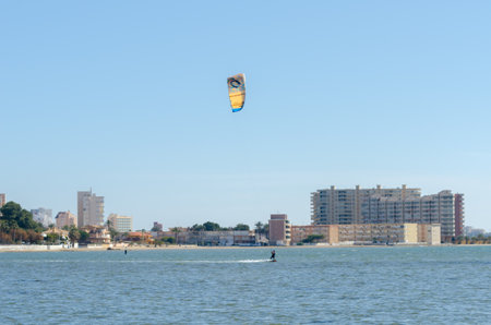 LA MANGA, SPAIN - 27 FEBRUARY 2019 People practising the water sport of kitesurfing on a shallow lagoon located in La Manga, Spainのeditorial素材