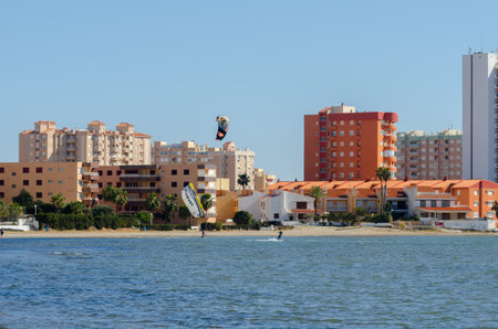 LA MANGA, SPAIN - 27 FEBRUARY 2019 People practising the water sport of kitesurfing on a shallow lagoon located in La Manga, Spainのeditorial素材