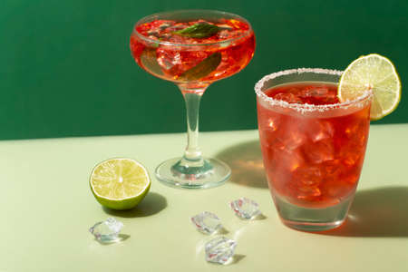 delicious cocktail with lime and straberryの写真素材