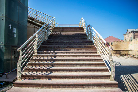 Stairway to the streets on the dirty sandの写真素材