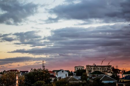 Blue sky with clouds over the village in the early morningの写真素材
