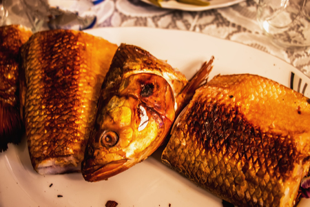 Smoked fish on the table for the guests to dinnerの写真素材